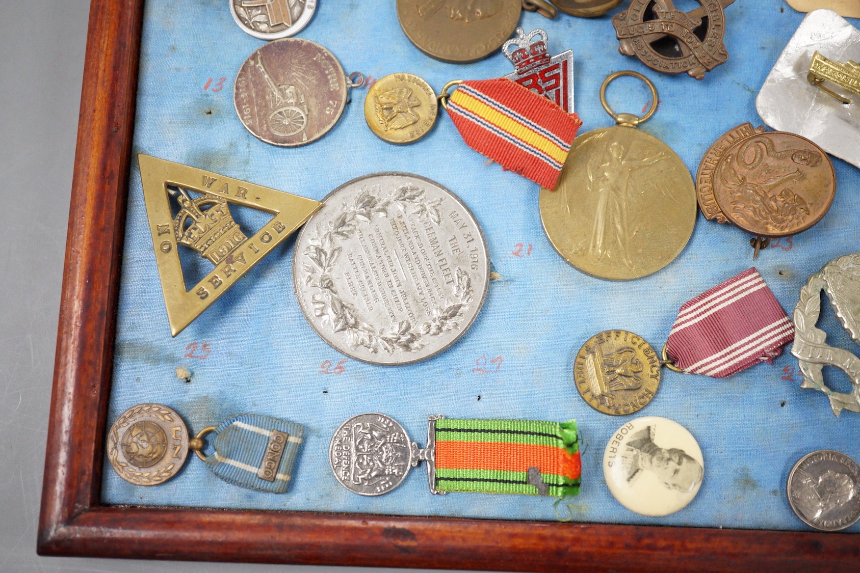 A group of WWI and WW2 and other military medals, badges and ephemera